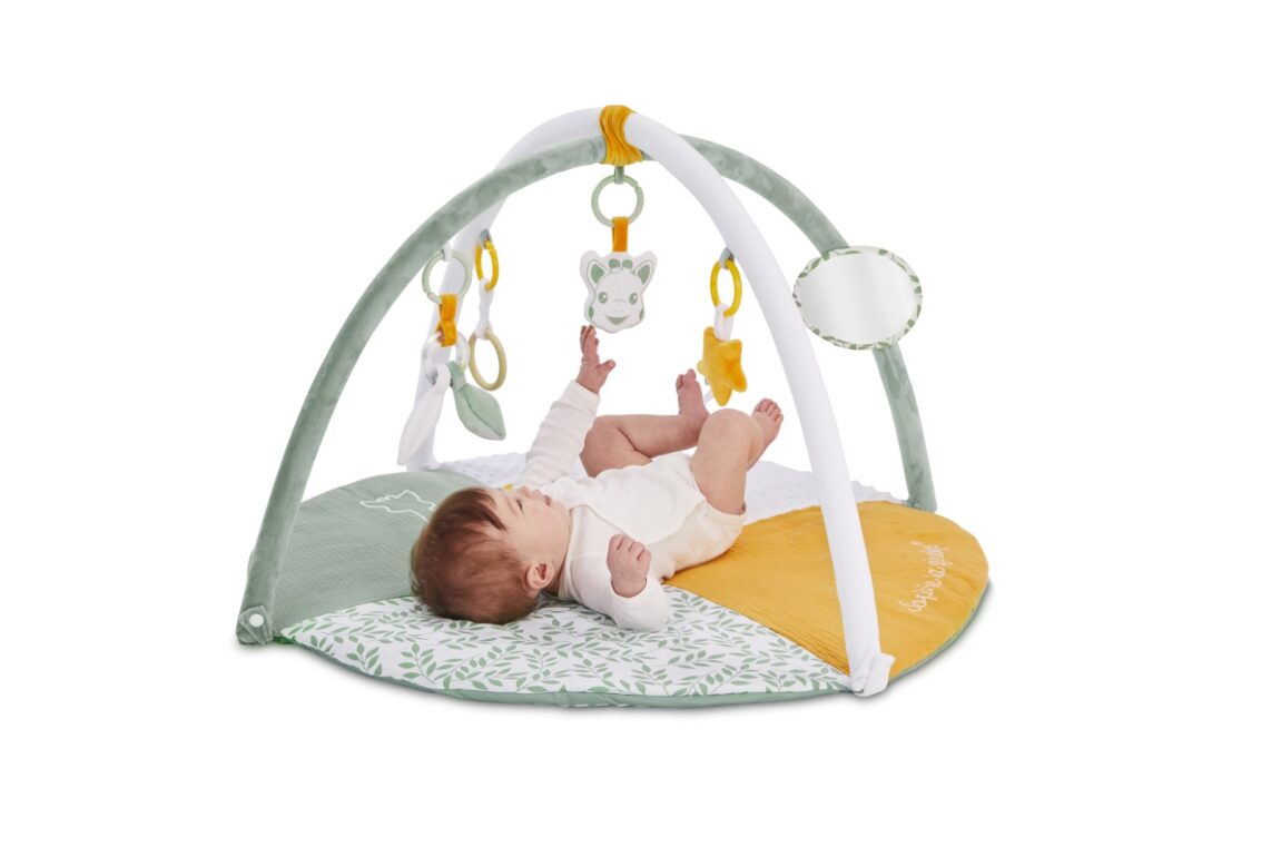 Baby playing on Sophie la girafe Playmat