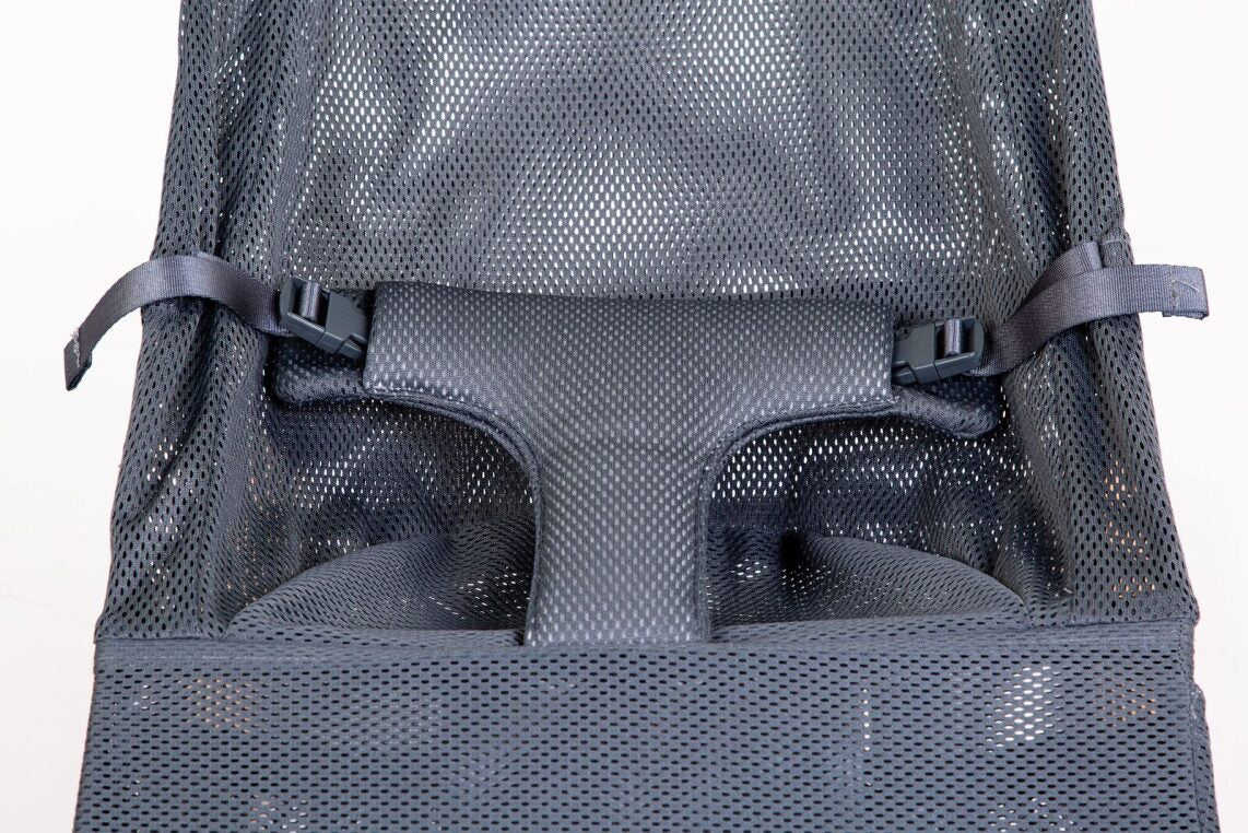 Close-up of the soft, charcoal gray fabric and sleek black frame of the Childhome Evolux Bouncer (Natural Anthracite).